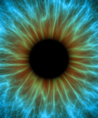 Iris bleu vu de près, semblant ouvrir sur un autre monde, symbolisant l'éveil des capacités extrasensorielles et la communica