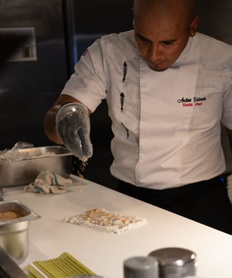 A professional sushi chef preparing a sushi roll at our Asian Fusion Bistro called Mr Chow.