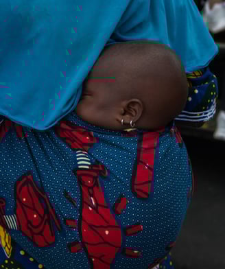 a woman in a blue dress with a blue blanket