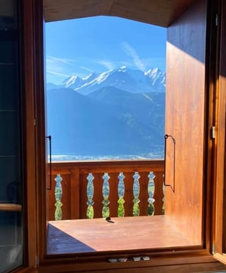 a view of a mountain view from a window