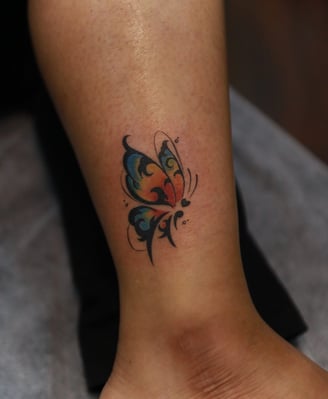 Unique Butterfly tattoo watercolor fill on leg by Dudo’s Hyderabad