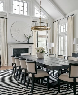a dining room with a large table and chairs