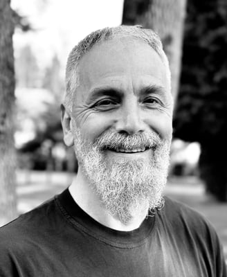 Harun Mehmet Soydan Tai Ji Qi Gong senior instructor of WDP Turkey, smiling outdoors in black shirt
