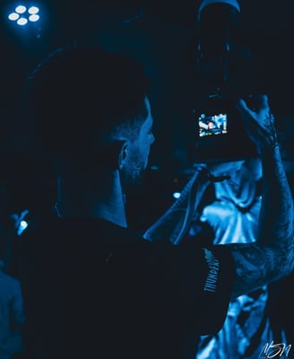 a man taking a picture of himself in the dark