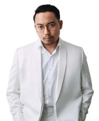 a man in a white suit and glasses