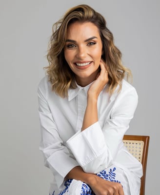 a woman in a white shirt and blue skirt