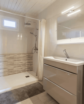a bathroom with a shower and a sink