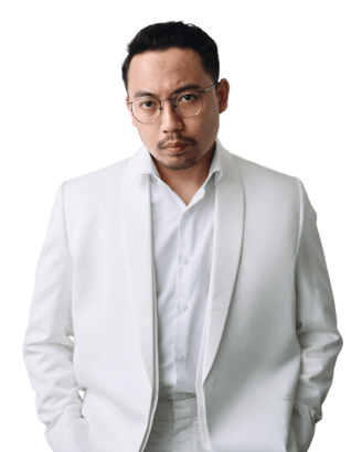 a man in a white suit and glasses