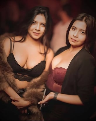 two women in lingersuits posing for a photo