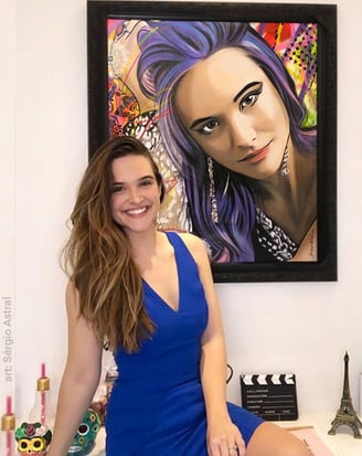 Contemporary pop-art works adorn the gallery walls.