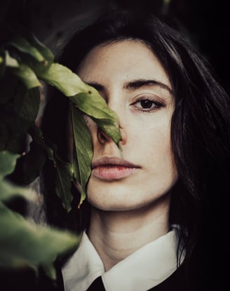 a woman with long hair and a white shirt