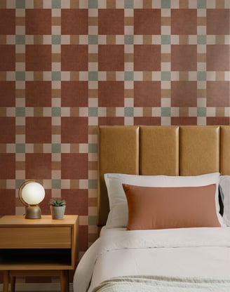Terracotta and stone checkered wallpaper with a bold mid-century grid pattern, styled in a cozy bed