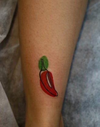 Abstract Red hot chilli tattoo with watercolor fill at Dudo's Tattoos Hyderabad