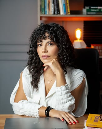 a woman lawyer sitting at a desk with a laptop