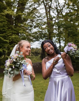 bride photographed with her maid of honour on her wedding day