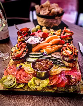a platter of food and wine glasses