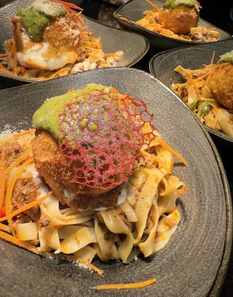 a plate of food with pasta and cheese