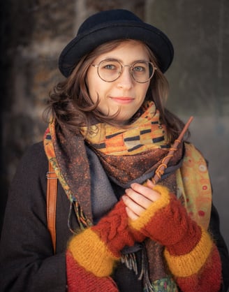 a woman in a hat and scarf around her neck