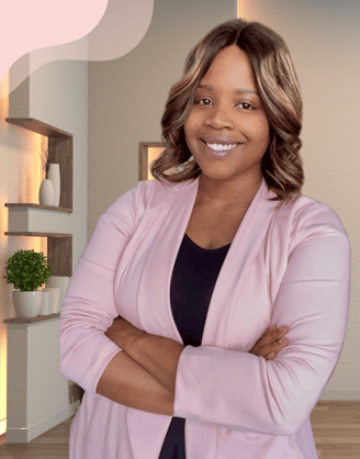 a black plus size woman nutritionist in a pink jacket and black top