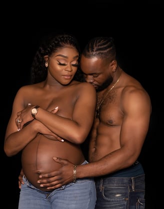a pregnant woman and a man are standing next to each other