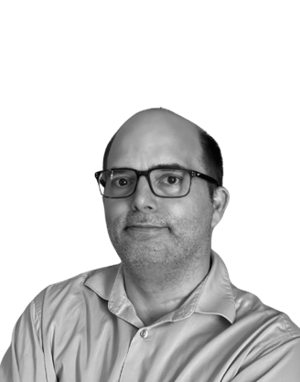 a man with glasses and a shirt on