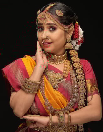 a woman in a traditional indian madisaar sari outfit