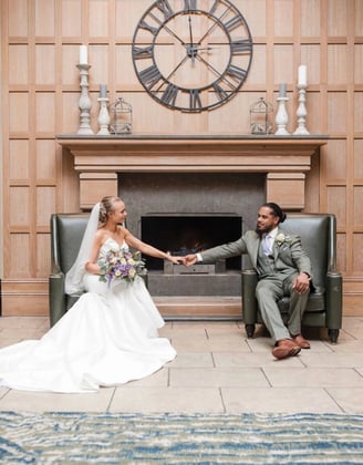 Newly weds hold hands in a beautiful wedding portrait