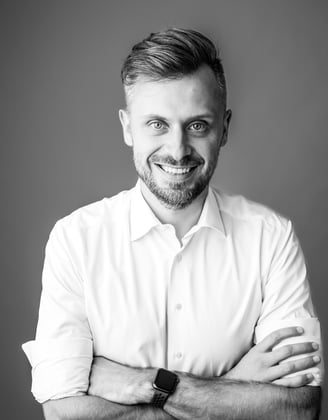 Black and White picture of a professional man in casual shirt smiling