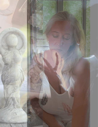 Eyes closed in stillness, with the image of an ancient goddess statue — evoking the sacred feminine