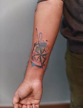 Watercolor abstract Compass tattoo by Dudo's Tattoos Hyderabad