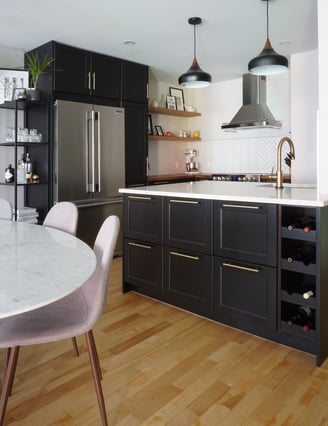 a kitchen with a marble table and chairs