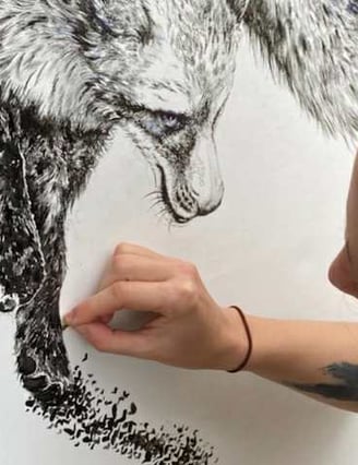 a woman is drawing a wolf in a drawing painting
