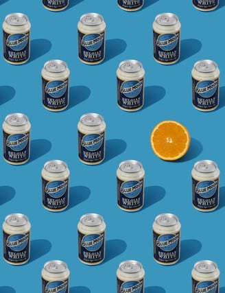 beer cans pattern and an orange