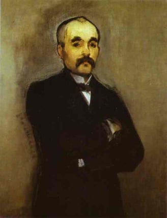 a man in a suit and tie is standing in front of a wall