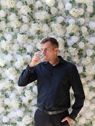 Event backdrop featuring a luxurious white rose flower wall rental in Shakopee, Minnesota