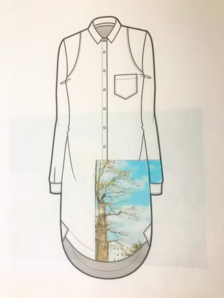 a shirted shirt with a picture of a tree in the background