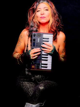 a woman with a guitar and a keyboard