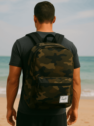 Rick Silvia wearing a camo Herschel backpack on a Thai Beach