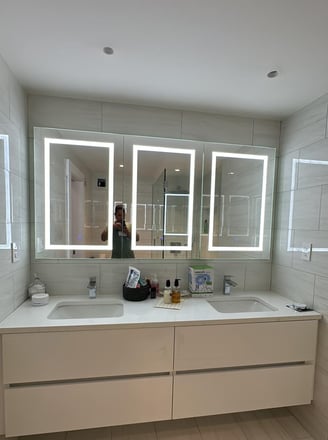 a bathroom with a mirror and a mirror