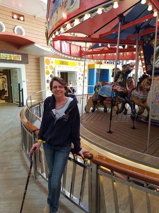 Lady Michelle pauses by the Merry-Go-Round on Harmony of The Seas