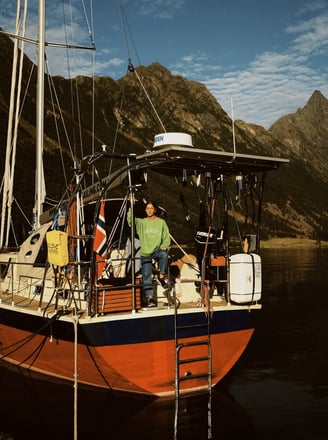Exploring the fjords aboard a cozy sailboat—Jolly Good Times Sailing in Arctic Norway.