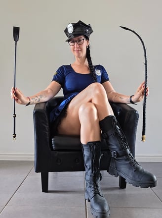 Pleasurelit Patricia dressed as a police officer with kinky tools