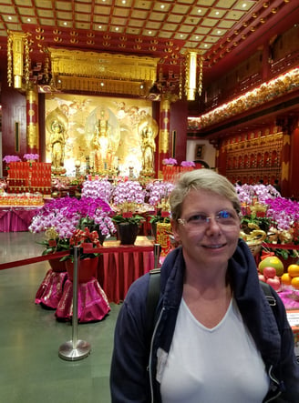 Lady Michelle is happy to be in the Buddha Tooth Relic Temple in Singapore