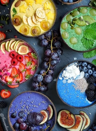 a variety of fruit and vegetables in bowls