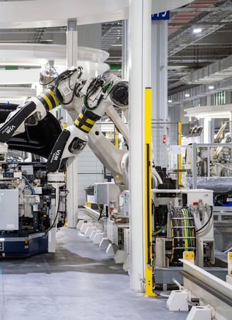 Robotic arms on an assembly line.