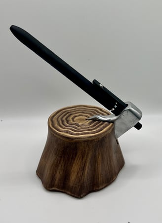 An axe-shaped pen dock