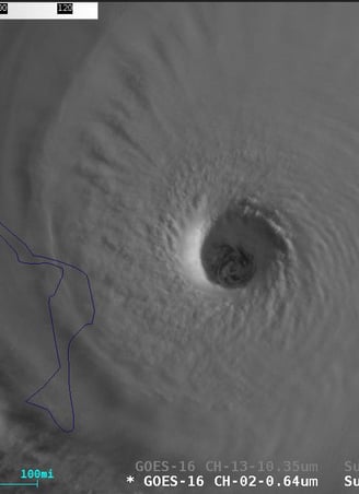 Sunlight and shadows help reveal the stadium or cone like shape of clouds of the eyewall in Hurricane Dorian (2019). (NOAA)