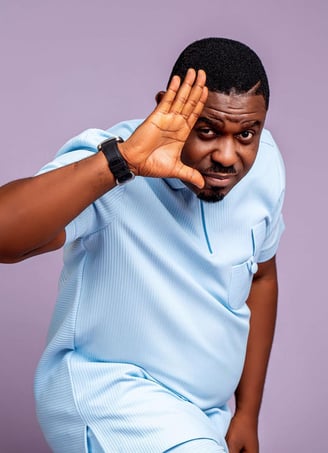 Nacee in a blue material shirt.