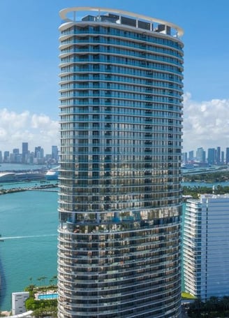 Panoramic view of Miami skyline with Five Park residential tower in foreground.