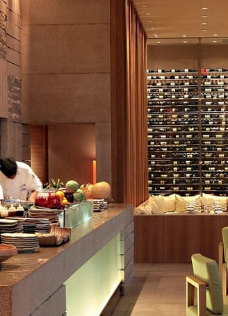 a restaurant with chefs and chefs in the background